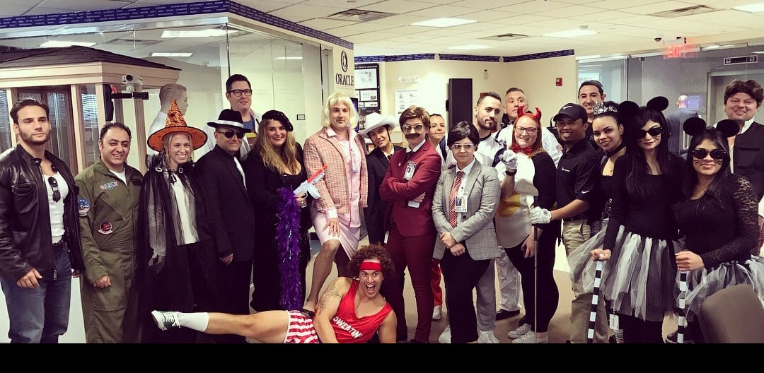 Planned employees in costume at a Halloween party