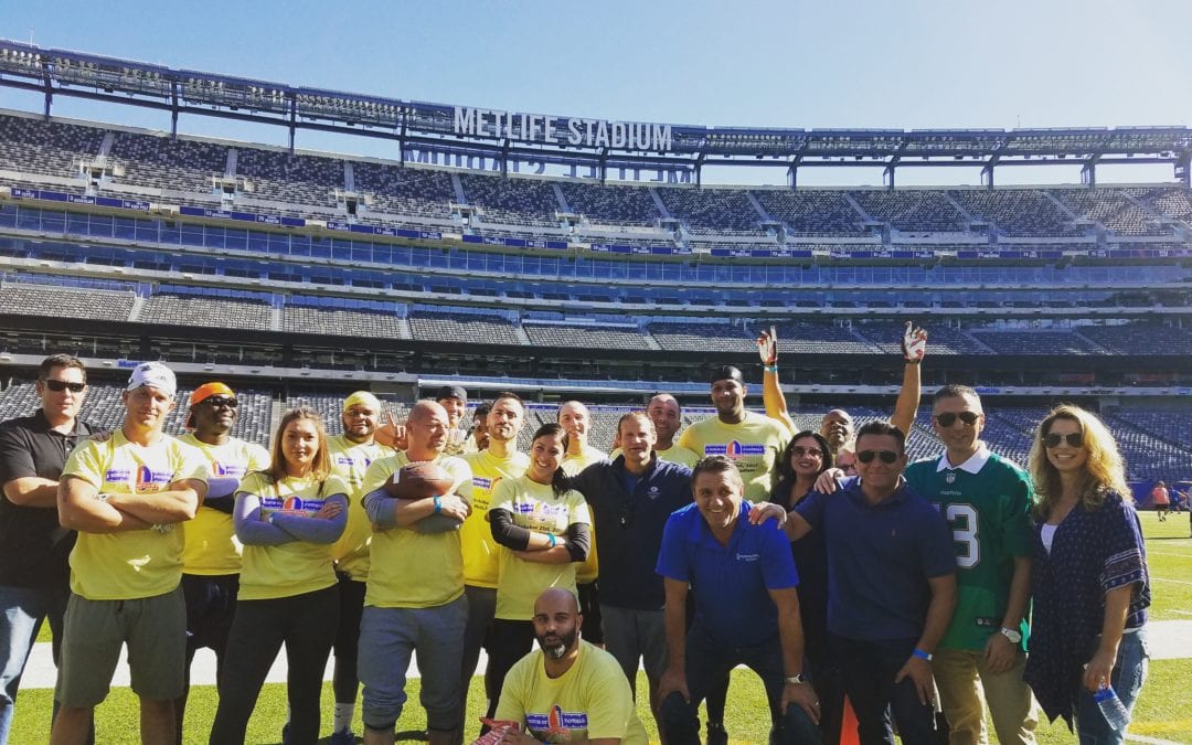 Planned employees at a charity event at Giants Stadium