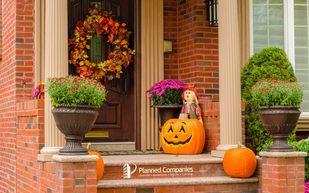 a doorstep with a Halloween pumpkin